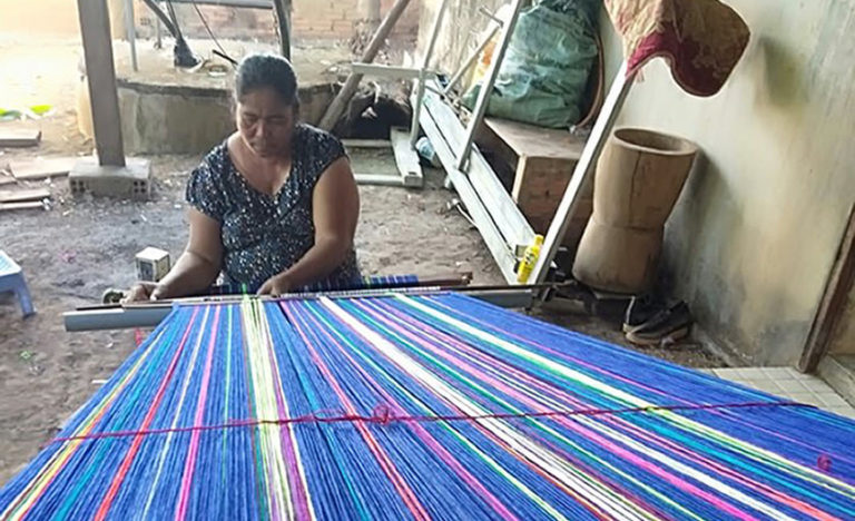 The author's sister weaving