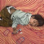 “This painting captures a tender moment of a toddler resting in the comforting embrace of a mother. The patterns within the artwork are inspired by a traditional baby blanket, symbolizing the nurturing care and warmth that surrounds the child. The toddler holds a spoon with food on it, further emphasizing the theme of nourishment—both physical and emotional—that a mother provides. The piece reflects the deep bond of love and security that a mother offers, creating a safe and loving space for the child to rest and grow.